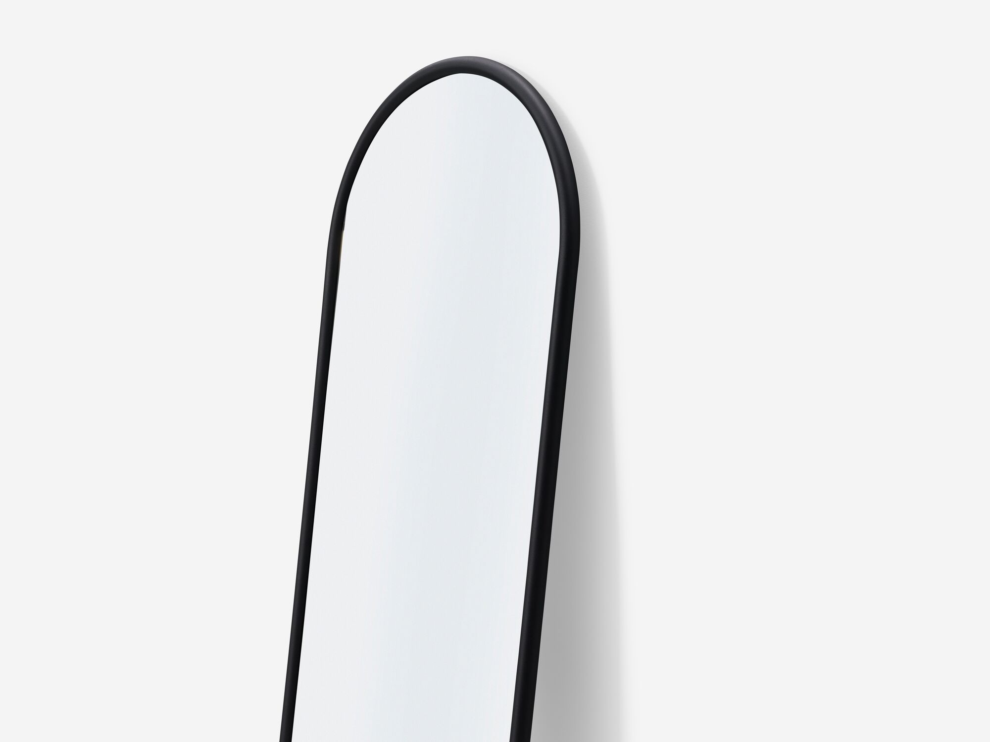 Full length mirror with black edge top detail view